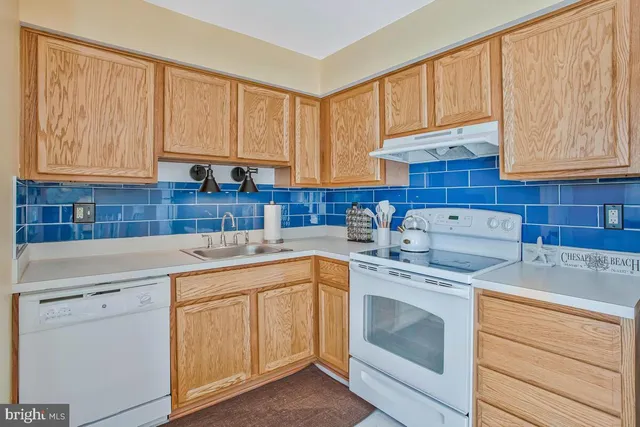 a large bed sitting in a bedroom next to a window