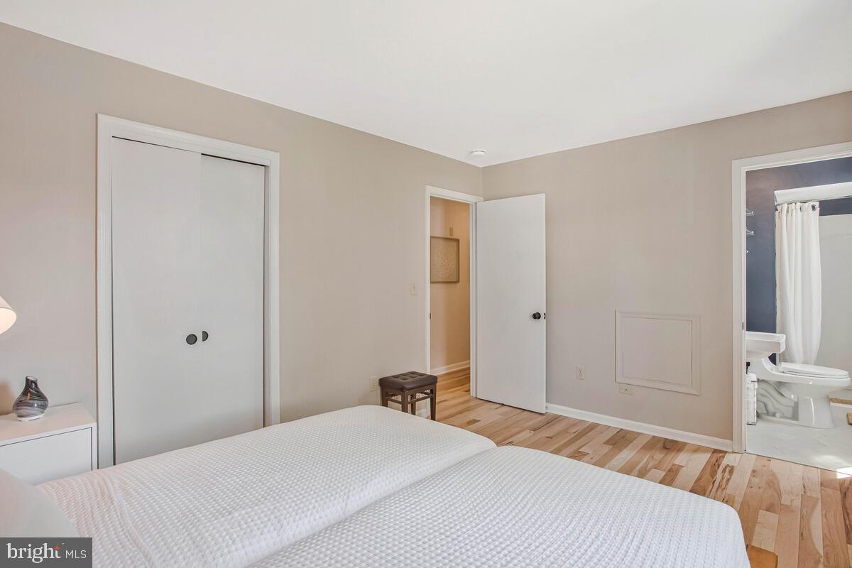 3709 29th Street Chesapeake Beach, MD 20732 - Photo 14 of 71 a bedroom with a bed and a mirror