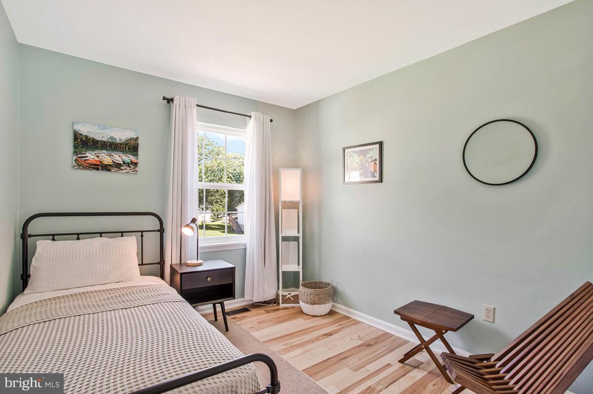 3709 29th Street Chesapeake Beach, MD 20732 - Photo 16 of 71 a bedroom with a bed and a window