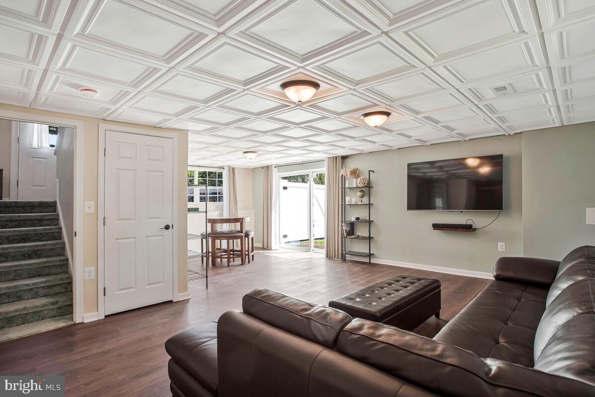 3709 29th Street Chesapeake Beach, MD 20732 - Photo 20 of 71 a living room with furniture and a flat screen tv