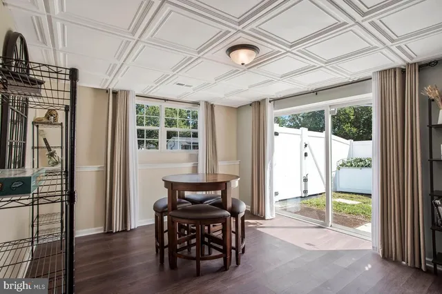 a bedroom with furniture and wooden floor
