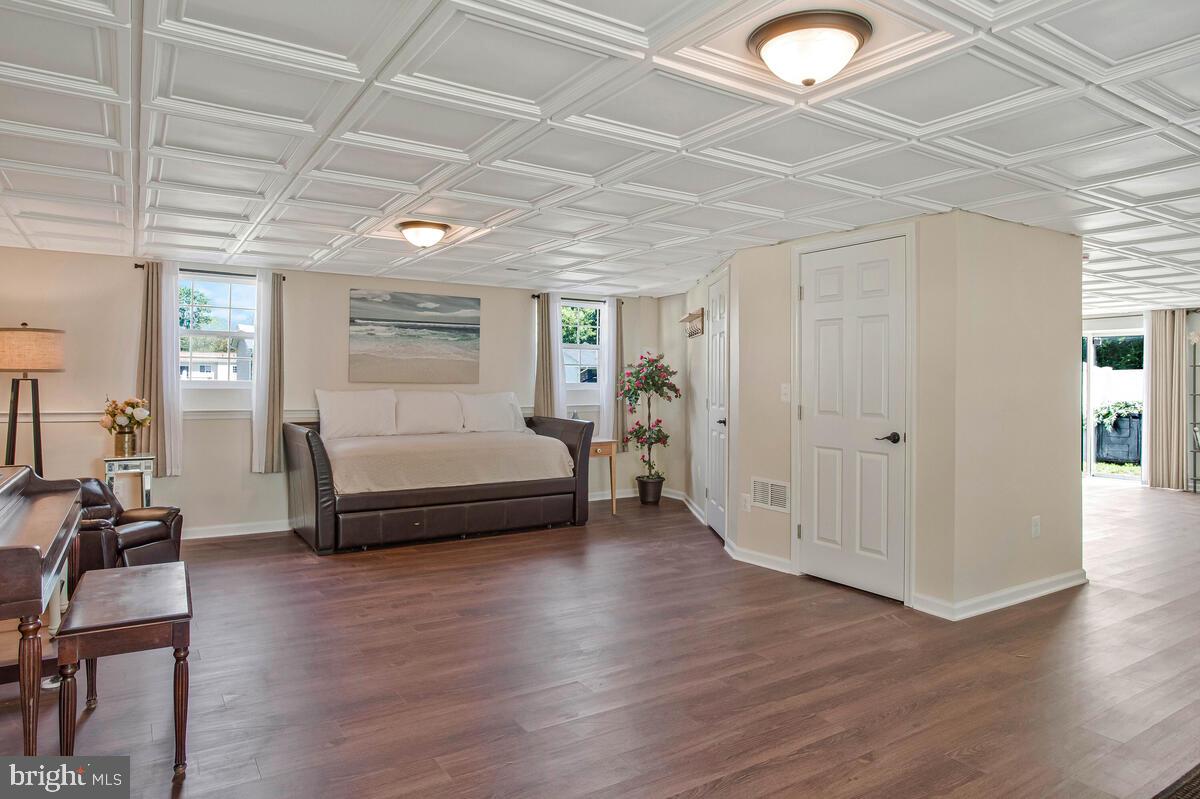 3709 29th Street Chesapeake Beach, MD 20732 - Photo 24 of 71 a bedroom with furniture and wooden floor