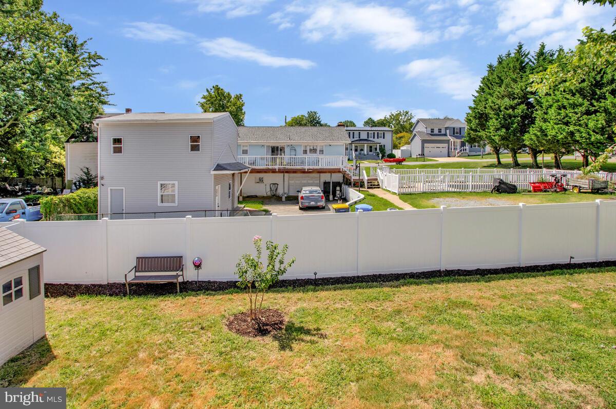 3709 29th Street Chesapeake Beach, MD 20732 - Photo 28 of 71 a swimming pool with outdoor seating and yard