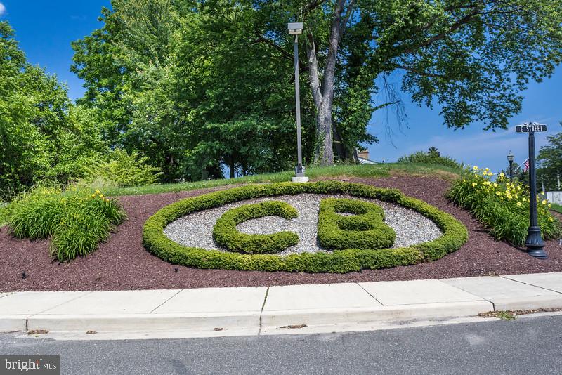 3709 29th Street Chesapeake Beach, MD 20732 - Photo 36 of 71 a white house with a yard and trees