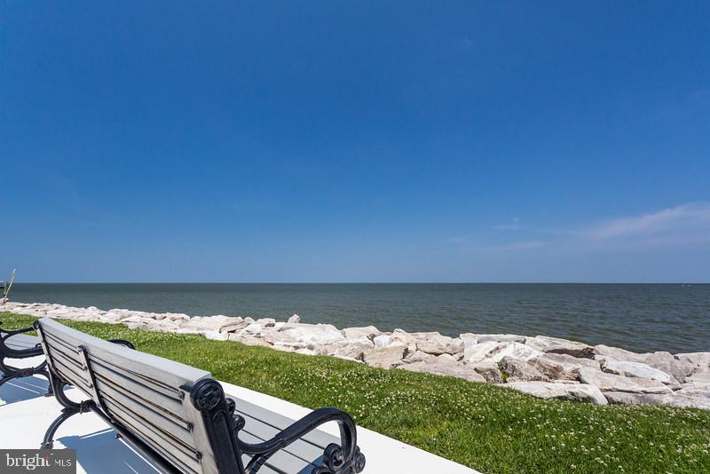 3709 29th Street Chesapeake Beach, MD 20732 - Photo 38 of 71 a view of a chairs and an umbrella in front of house