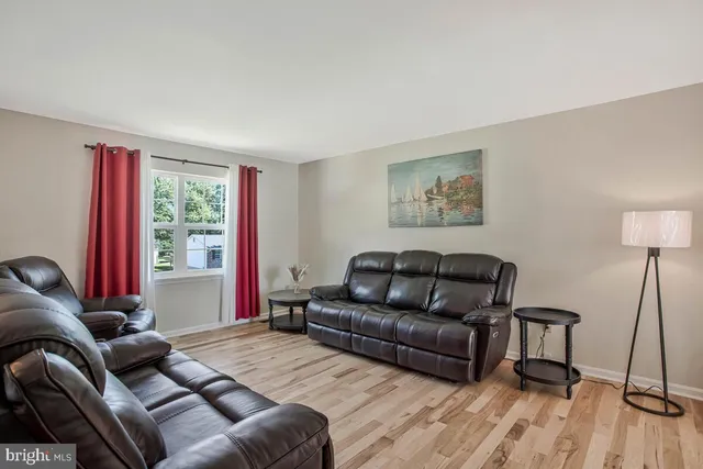 a living room with a couch and a window