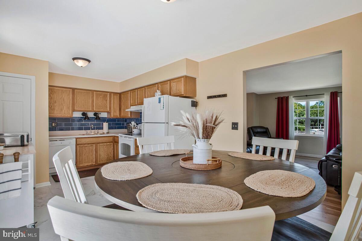 3709 29th Street Chesapeake Beach, MD 20732 - Photo 8 of 71 a kitchen with a table and chairs