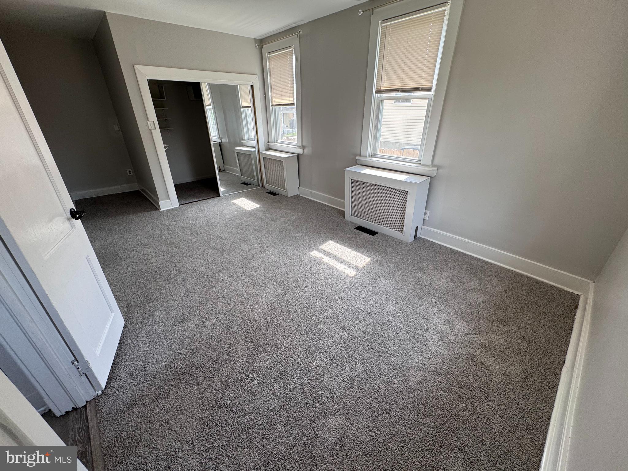 222 Townsend Avenue Baltimore, MD 21225 - Photo 11 of 24 an empty room with windows