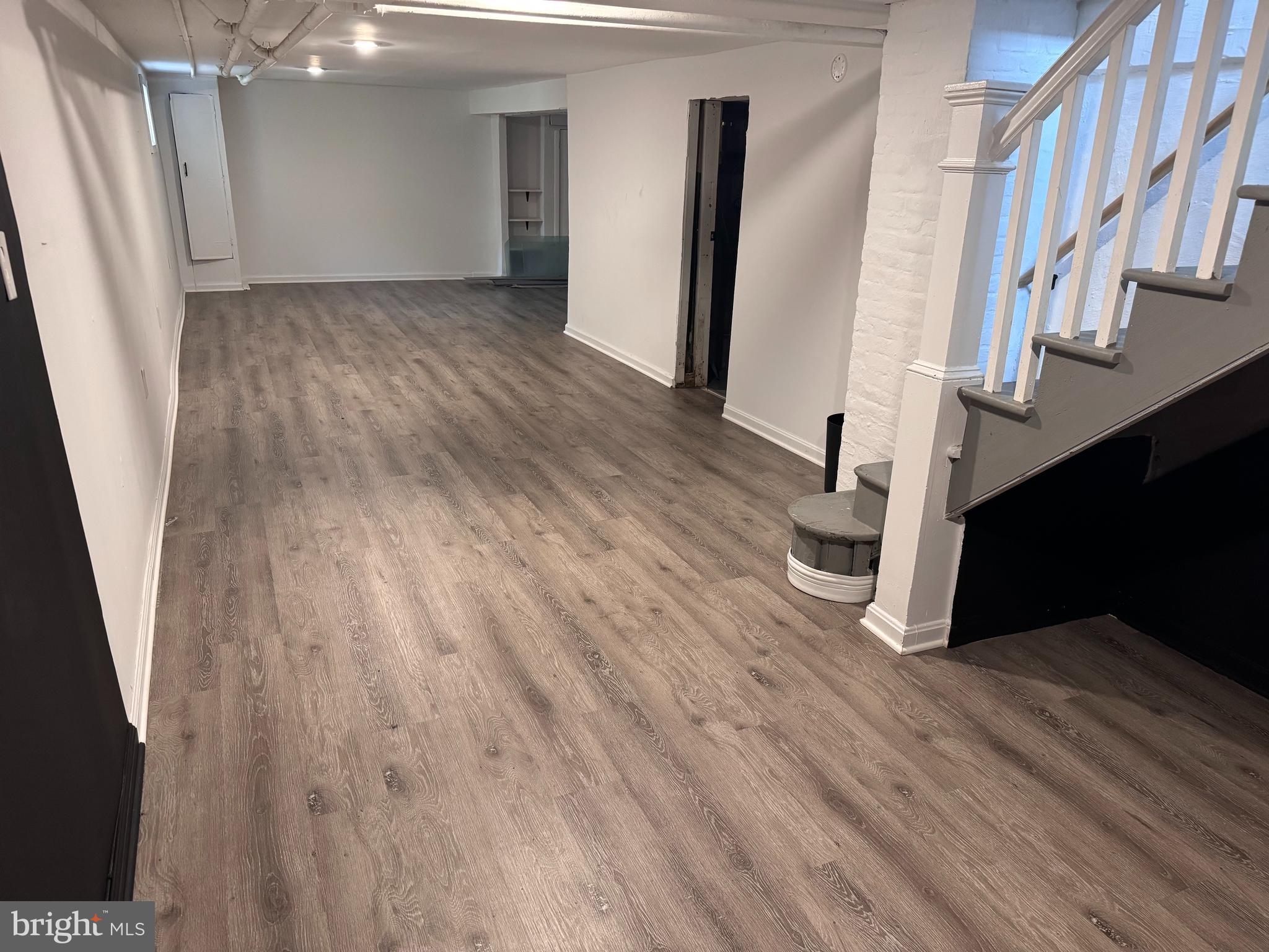 222 Townsend Avenue Baltimore, MD 21225 - Photo 14 of 24 wooden floor in a hall with an entryway
