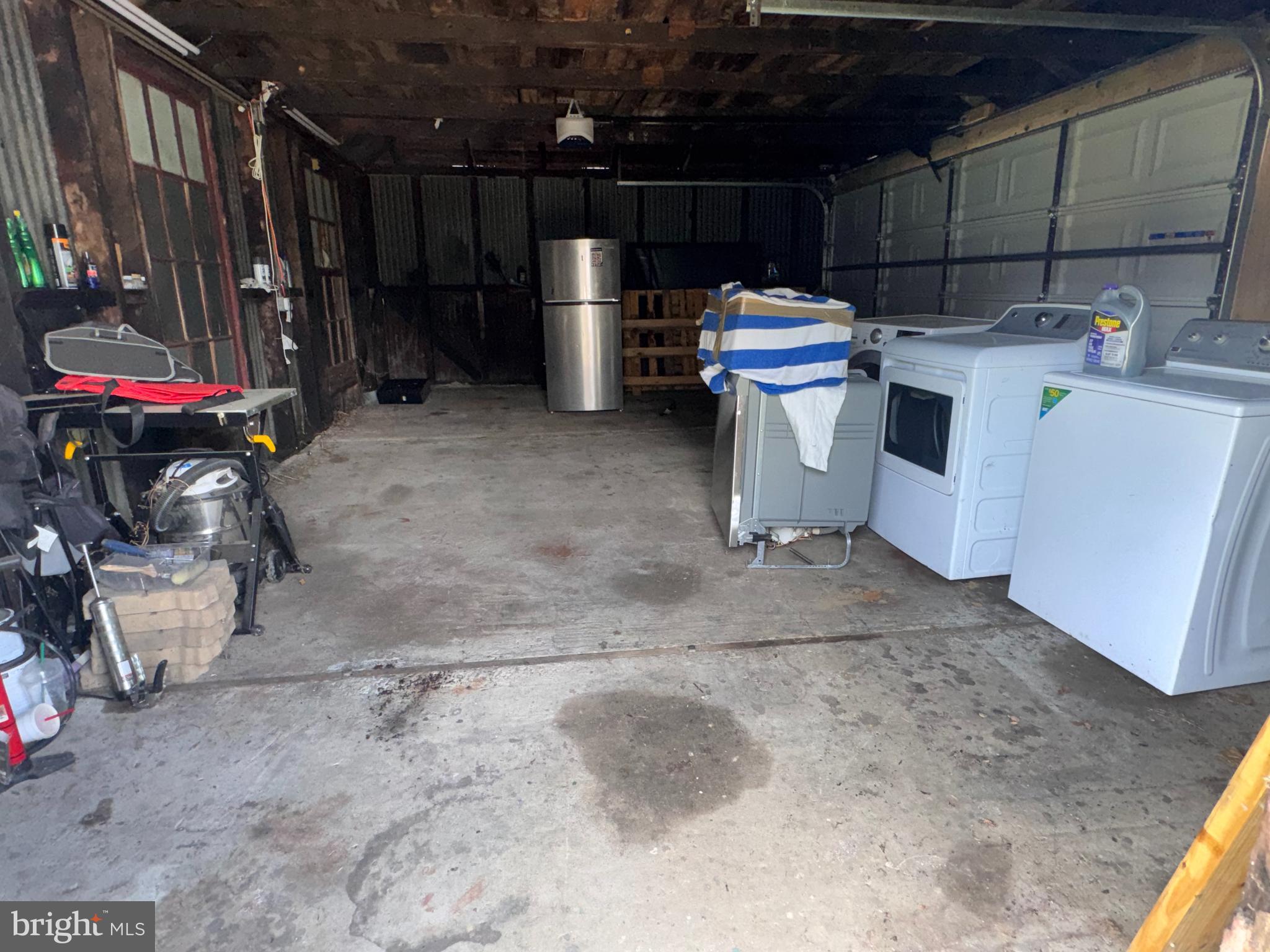 222 Townsend Avenue Baltimore, MD 21225 - Photo 24 of 24 a view of a storage room with washer and dryer