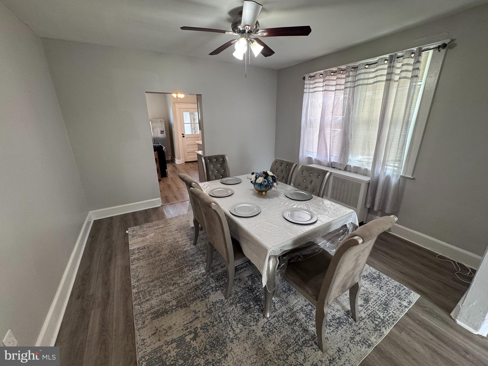 222 Townsend Avenue Baltimore, MD 21225 - Photo 5 of 24 a view of a dining room with furniture window and wooden floor