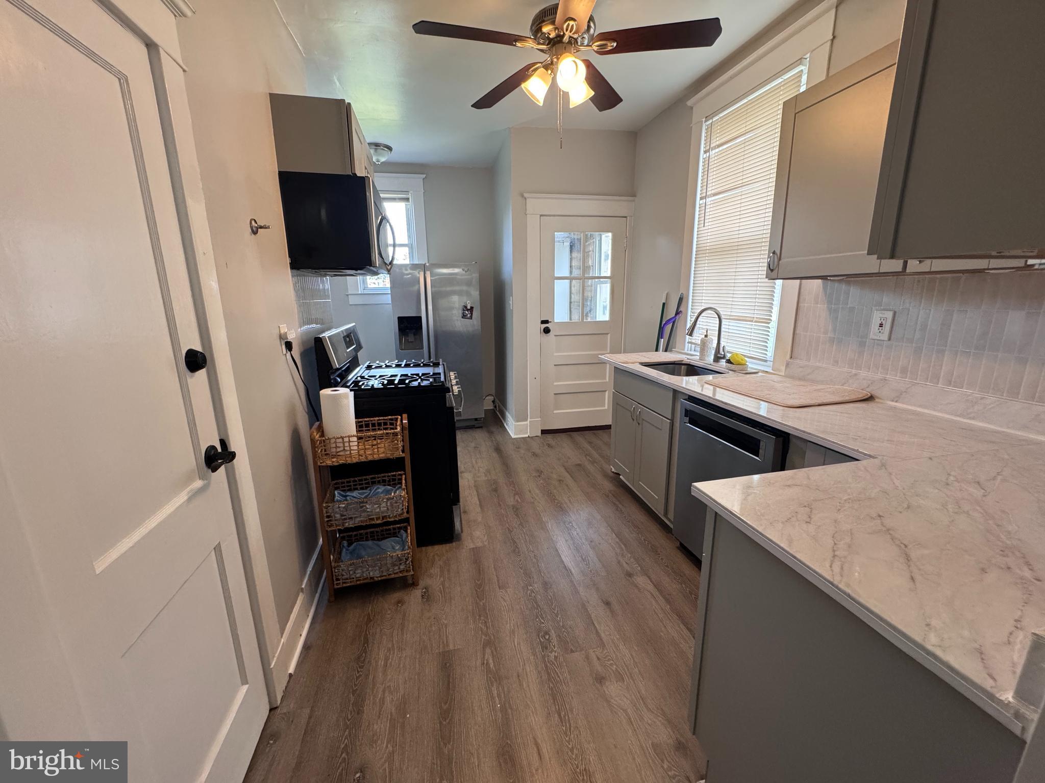 222 Townsend Avenue Baltimore, MD 21225 - Photo 7 of 24 a kitchen with a sink appliances and cabinets