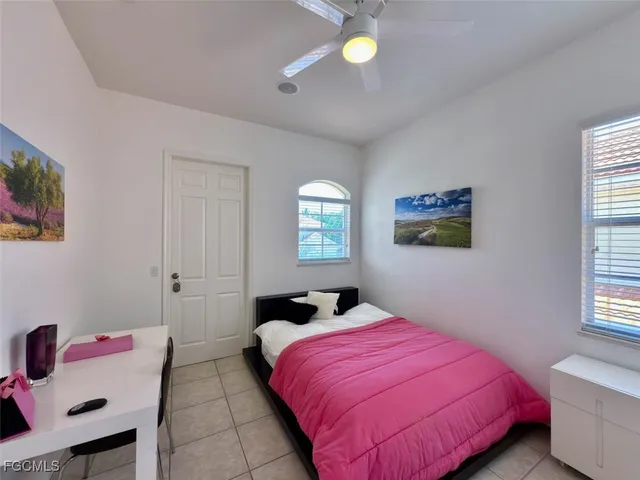 a bathroom with a sink a toilet and a window