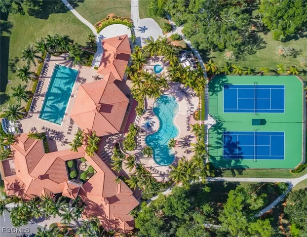 an aerial view of a house with garden space and outdoor seating