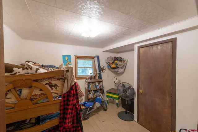 a view of a room with furniture and a window