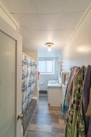 a bedroom with furniture and a flat screen tv