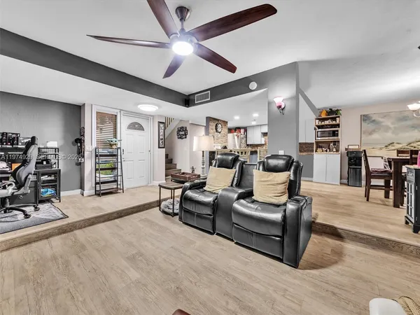 a kitchen with stainless steel appliances kitchen island granite countertop a stove and a sink