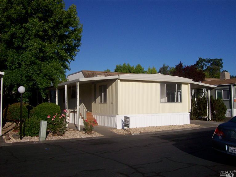 103 Cardinal Way, Unit 103 Santa Rosa, CA 95409 - Photo 1 of 1 a front view of a house with a yard