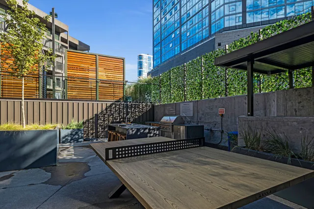 a view of a patio with couches and a fire pit