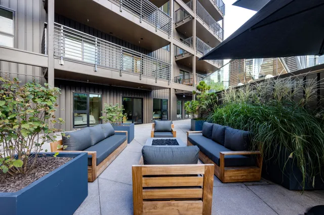 a view of a patio with a table and chairs