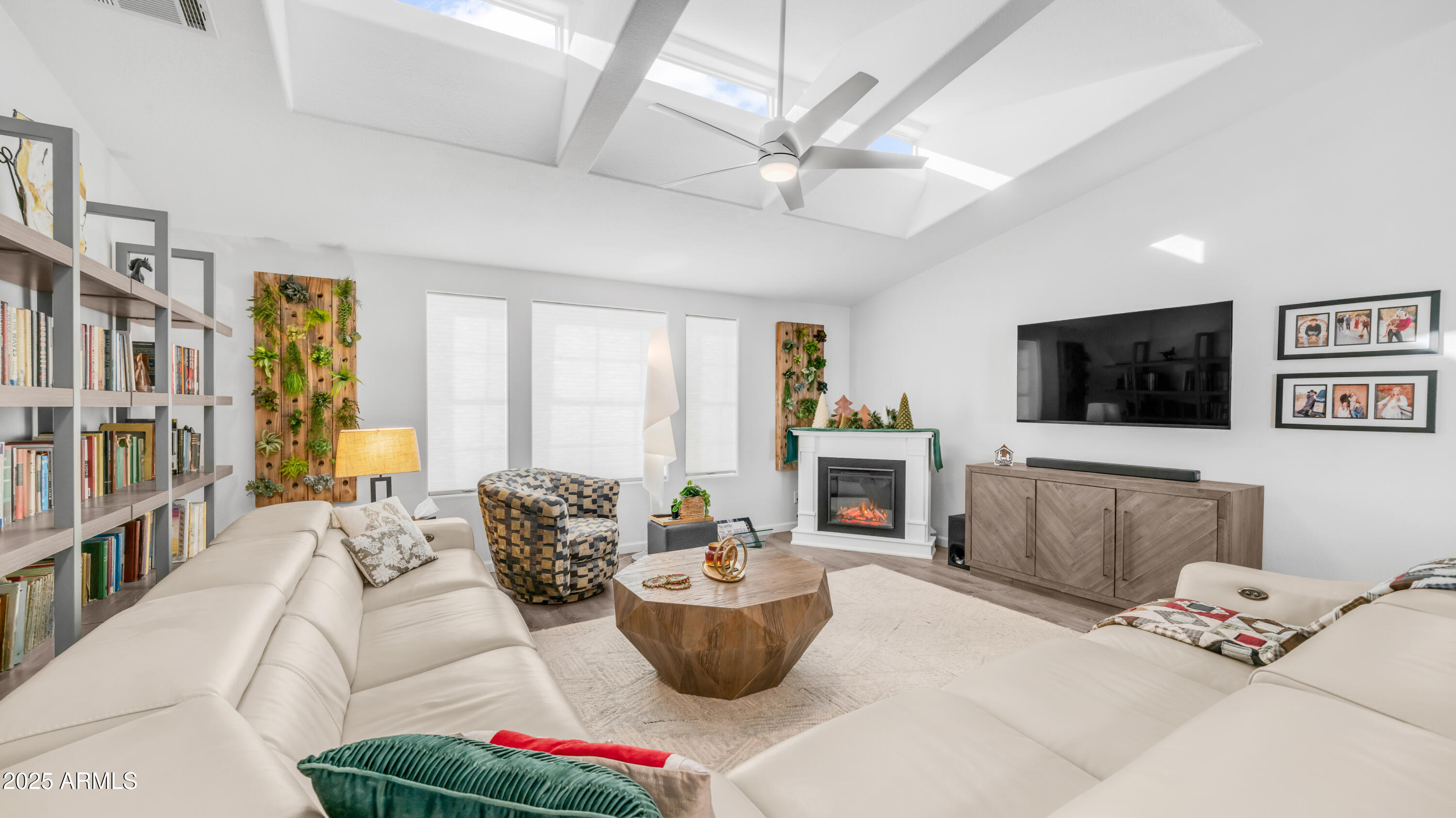 2550 South Ellsworth Road, Unit 751 Mesa, AZ 85209 - Photo 6 of 27 a living room with furniture and a flat screen tv