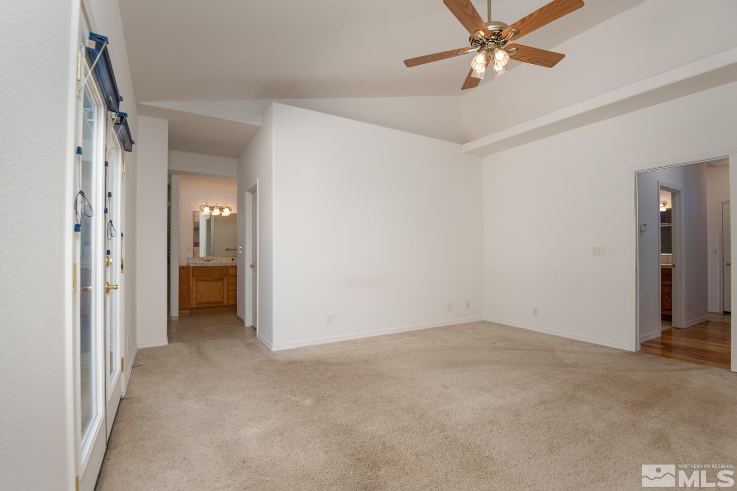 2876 Jackie Circle Minden, NV 89423 - Photo 14 of 40 a view of a room with a ceiling fan and closet area