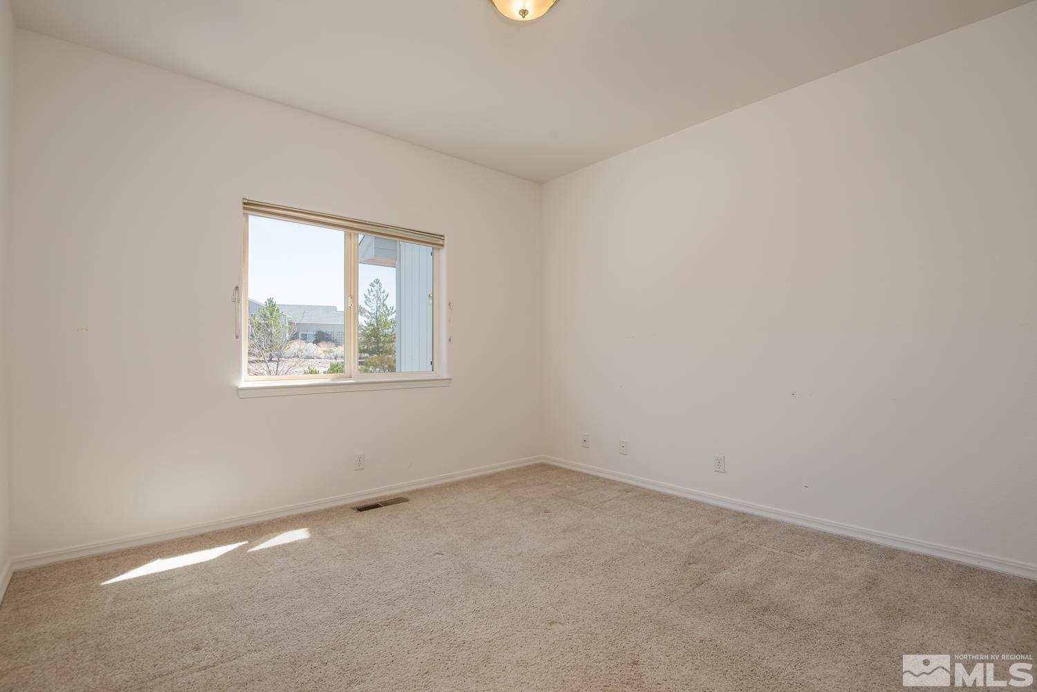 2876 Jackie Circle Minden, NV 89423 - Photo 19 of 40 an empty room with a window