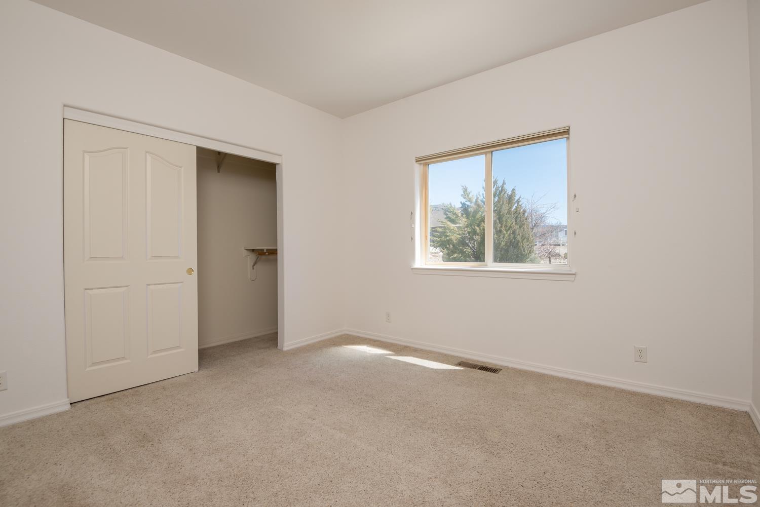 2876 Jackie Circle Minden, NV 89423 - Photo 20 of 40 an empty room with windows and closet