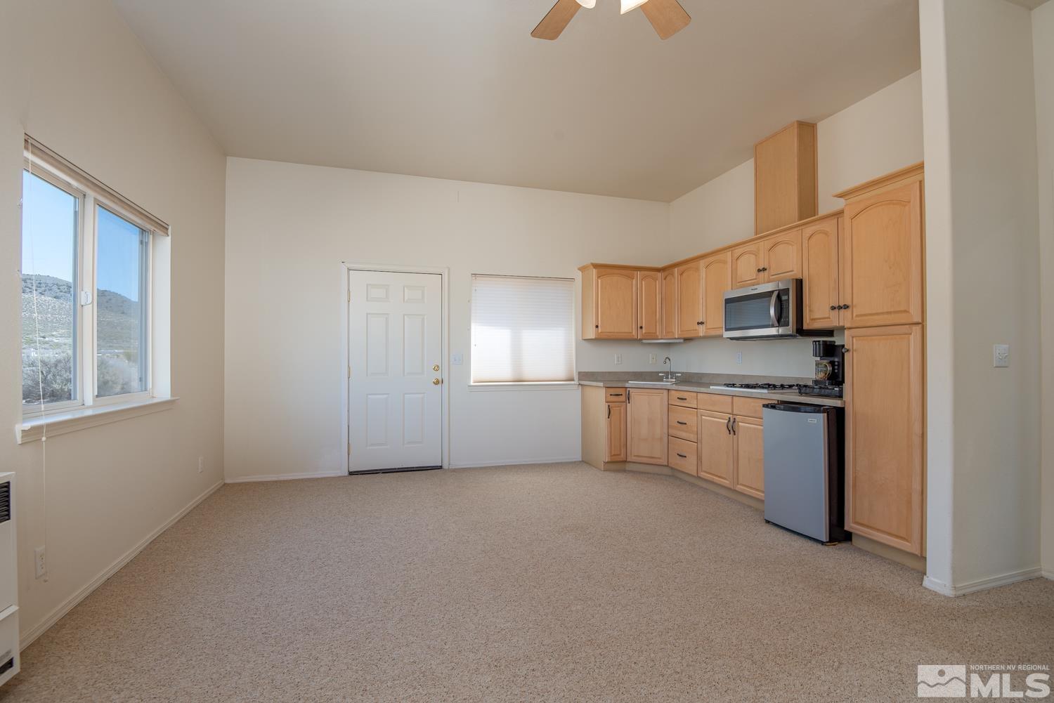 2876 Jackie Circle Minden, NV 89423 - Photo 29 of 40 a kitchen with a refrigerator stove and microwave