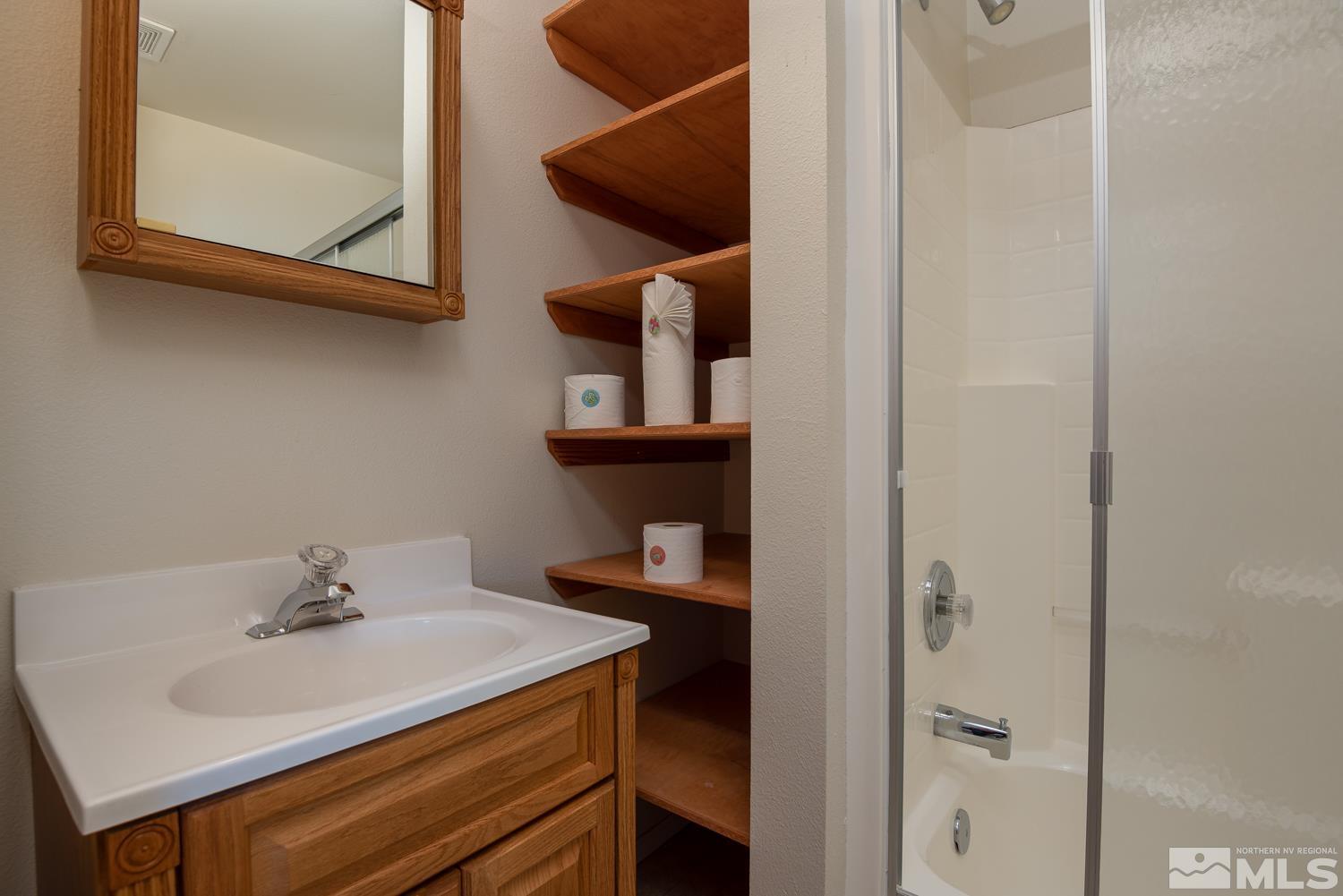2876 Jackie Circle Minden, NV 89423 - Photo 30 of 40 a bathroom with a sink and a mirror
