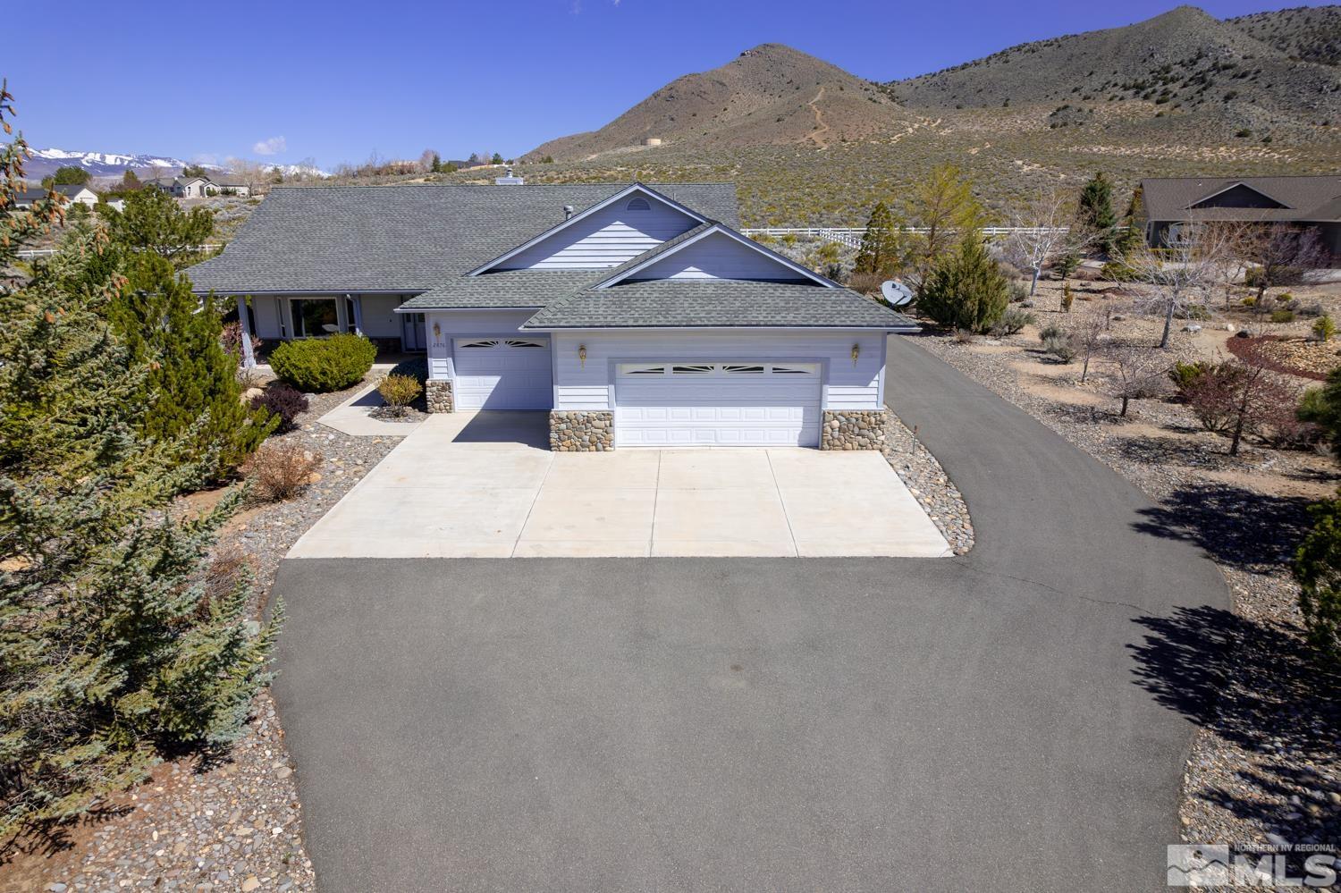 2876 Jackie Circle Minden, NV 89423 - Photo 3 of 40 a view of a house with a yard and balcony