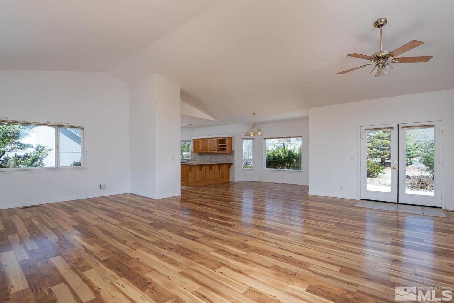 2876 Jackie Circle Minden, NV 89423 - Photo 7 of 40 a view of empty room with wooden floor and fan