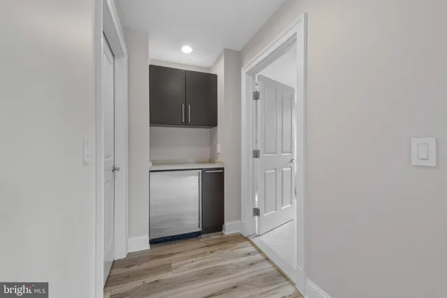 a bathroom with a shower and a sink
