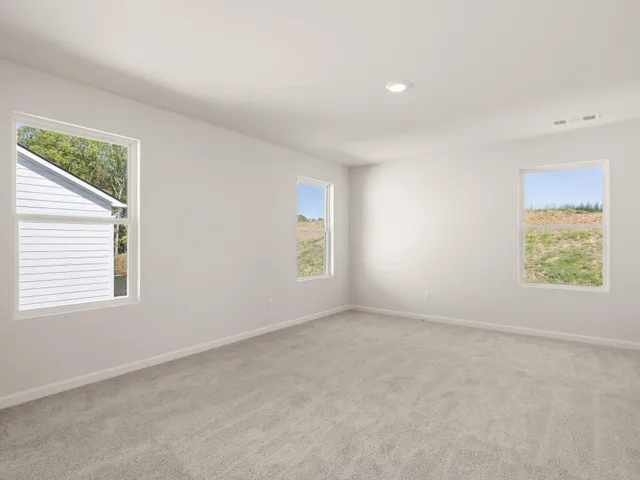 an empty room with windows