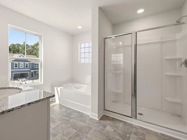 a bath tub sitting next to a window