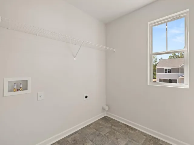 an empty room with windows and wooden floor