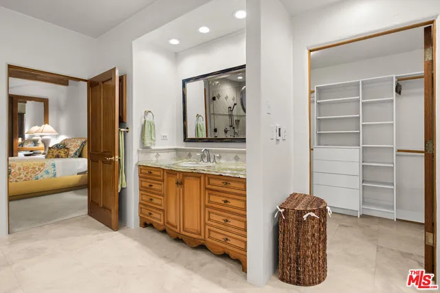 a hall with cabinets and a wooden floor