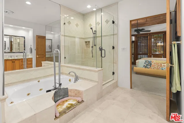 a bathroom with a tub and shower