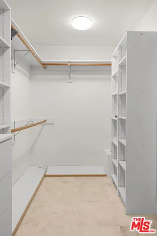 a view of an empty walk in closet