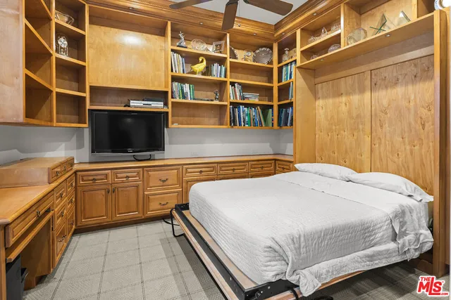 a bedroom with a bed and furniture