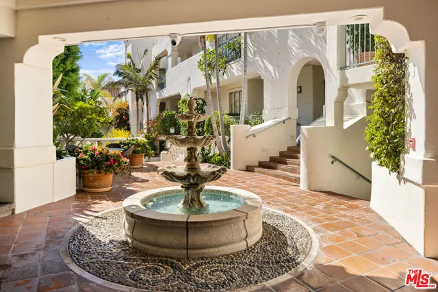 a living room with furniture and a swimming pool