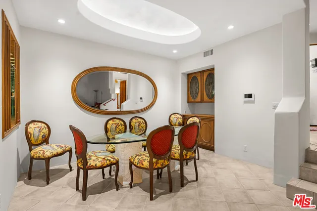 a living room with furniture and a chair