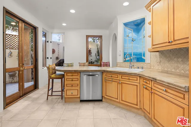 a kitchen with a sink and cabinets