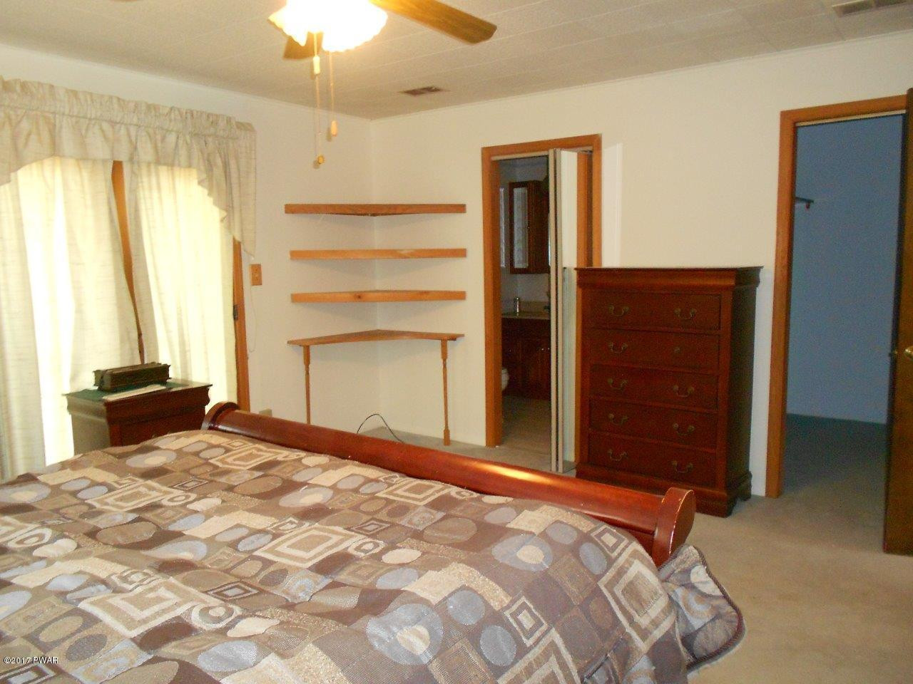 369 Roemerville Road Greentown, PA 18426 - Photo 32 of 45 a bedroom with a bed and a window