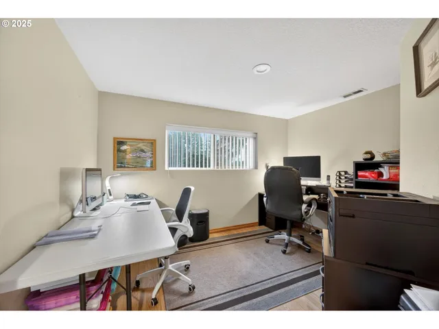 a view of a workspace with furniture