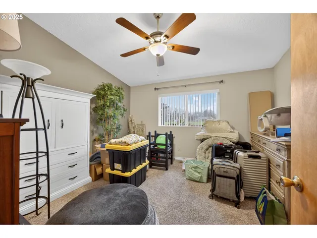 a living room with furniture a air conditioner vent and a window