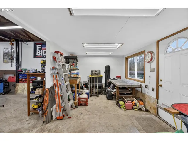 a living room with lots of furniture and gym equipment
