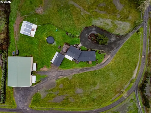 an aerial view of a house with outdoor space