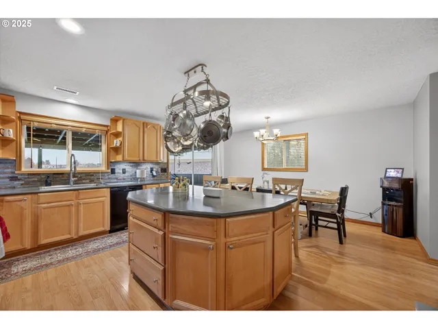 a view of a kitchen and dining table