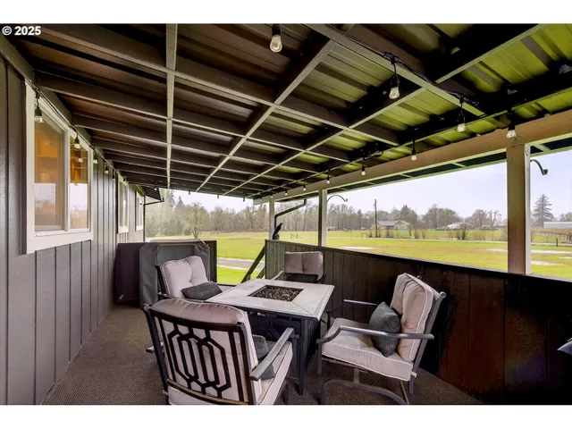 a view of swimming pool with a table and chairs